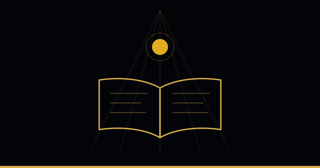 An open book beneath a source of light