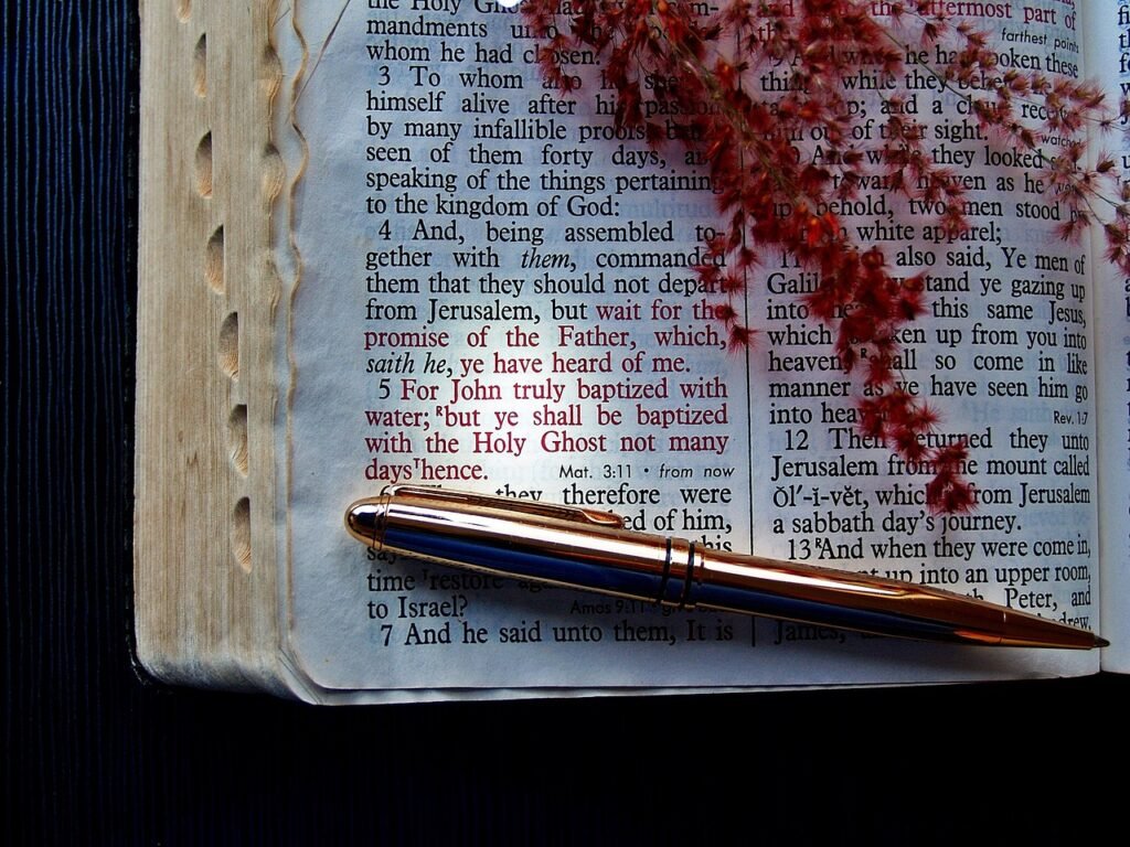 Bible verse written by a pen, guided by the Holy Ghost